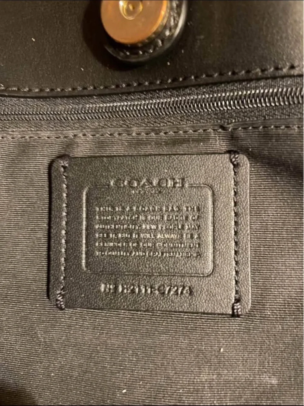 This is the Coach City Tote in Signature Canvas with Vintage Mini Rose Print